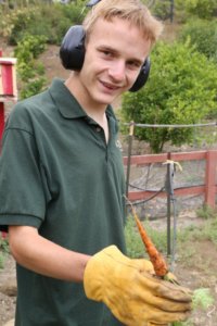 Neal Katz shows that hard work pays off with his fully grown crops, at Camp JCA Shalom in Malibu (photo credit POSITIVE EXPOSURE)