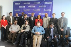 Fellows posing with Eddie Ellis and Janie Jeffers in front of a RespectAbility banner