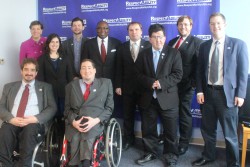 Fellows posing with Rodney Hood of JP Morgan Chase in front of a RespectAbility banner