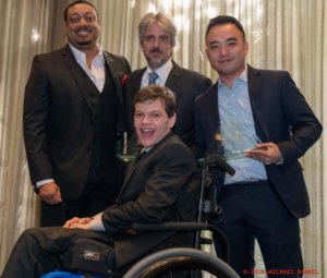 Speechless' Cedric Yarbrough, Scott Silveri, Melvin Mar and Micah Fowler smiling and posing with Silveri and Mar's award