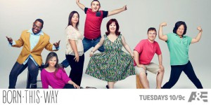 Image of cast facing camera and smiling, text on bottom says Born This Way is on A&E on Tuesdays at 10/9c
