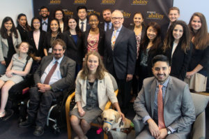 Curt Decker and RespectAbility Fellows standing and seated in a posed photograph, smiling for the camera