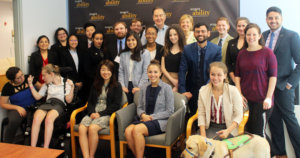 Cal Thomas and RespectAbility Fellows standing and seated in a posed photograph, smiling for the camera