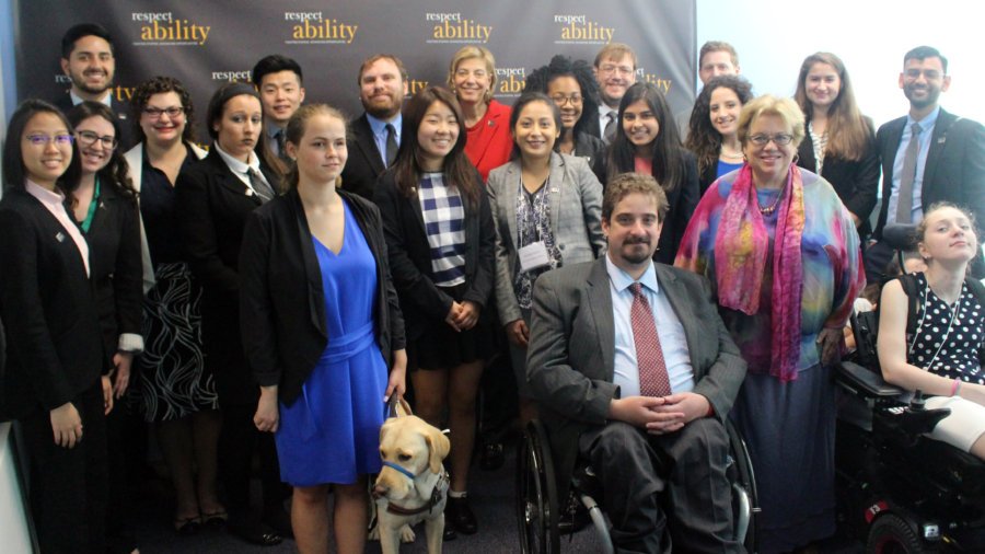 Celinda Lake and RespectAbility Fellows standing and seated in a posed photograph, smiling for the camera