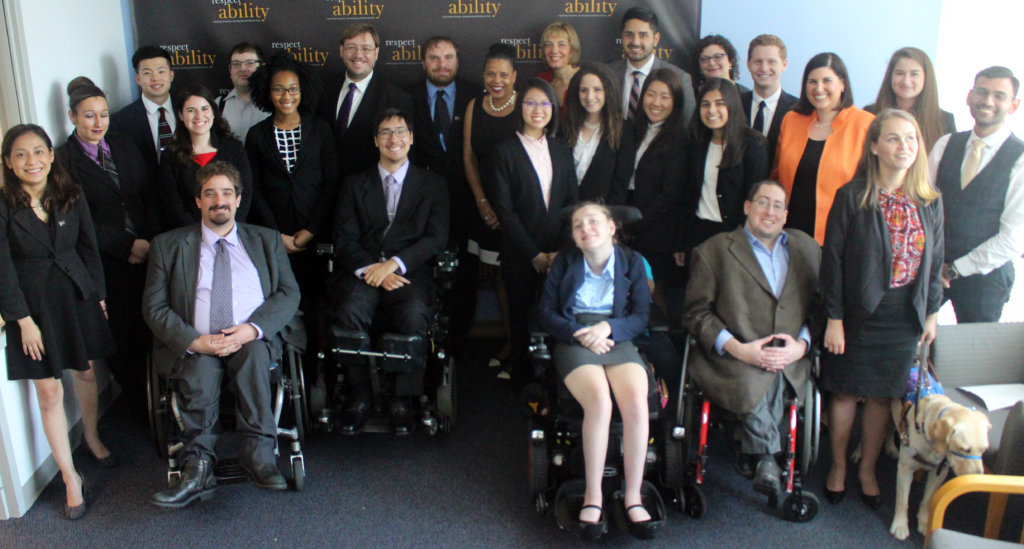 Donna Walton and RespectAbility Fellows standing and seated in a posed photograph, smiling for the camera