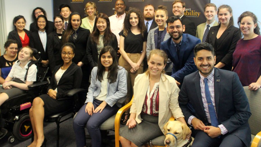 Gerard Robinson and RespectAbility Fellows standing and seated in a posed photograph, smiling for the camera