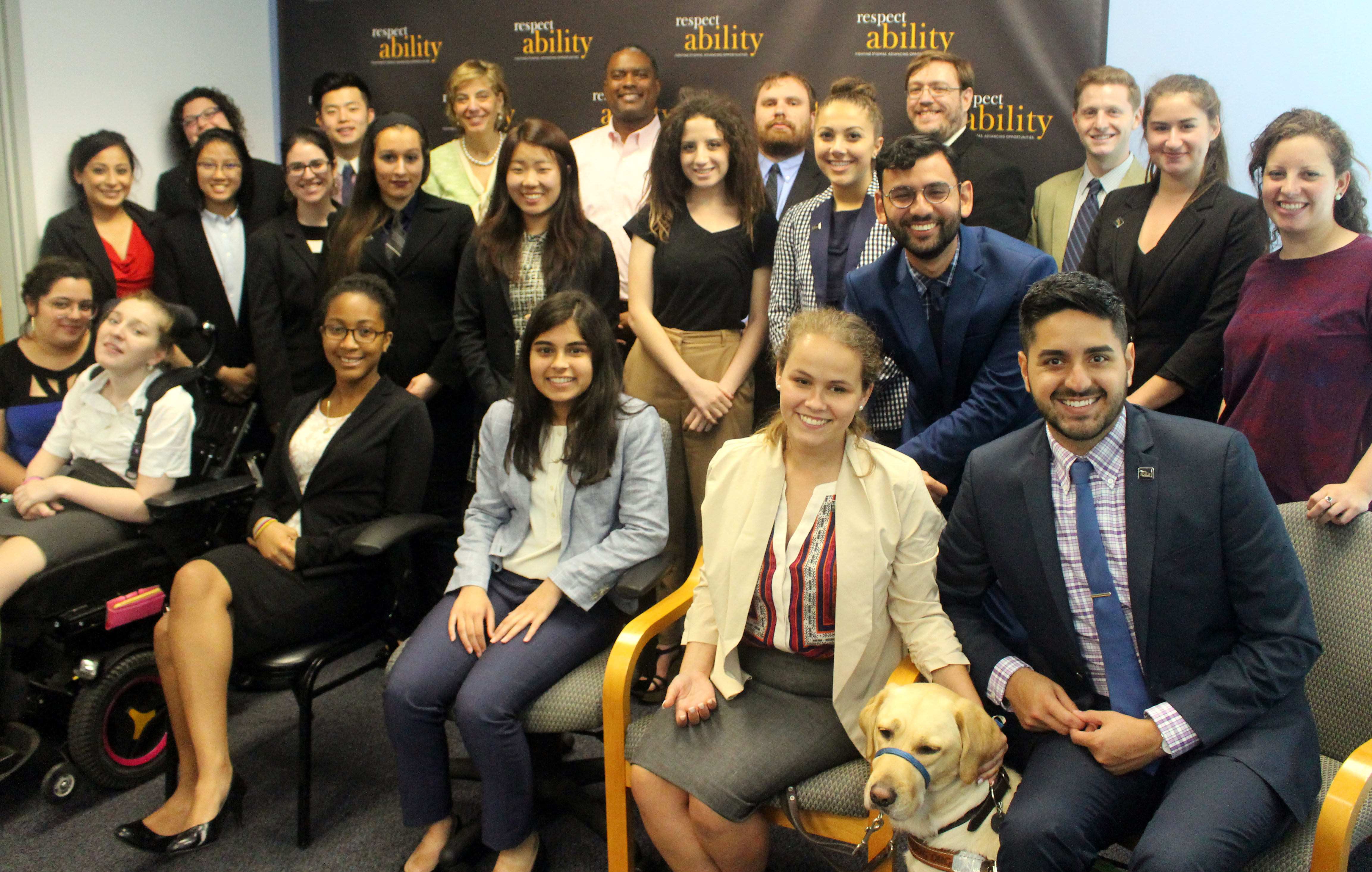 Gerard Robinson and RespectAbility Fellows standing and seated in a posed photograph, smiling for the camera