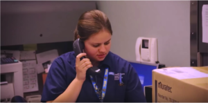 A young woman answering the phone