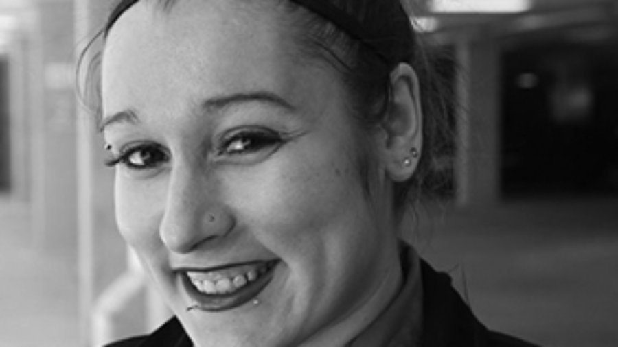 headshot of Amelia Heider wearing her hair up grayscale photo