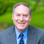 Donn Weinberg wearing a suit tie color photo