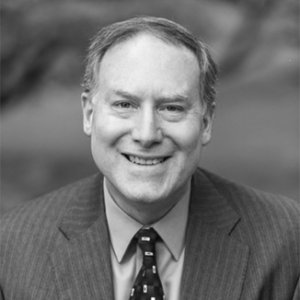 Donn Weinberg wearing a suit tie grayscale photo