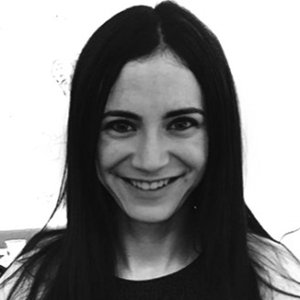 headshot of Gabrielle Einstein-Sim smiling and facing the camera wearing a tank top grayscale photo