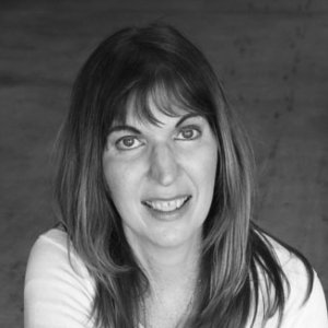 headshot of Heidi Daroff facing the camera and wearing a cardigan grayscale photo