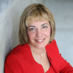 Headshot of Jennifer Mizrahi, smiling and facing the camera