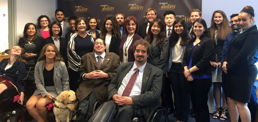 Judith Creed with the fellows sitting and standing around her