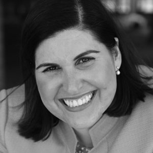 headshot of Lauren Appelbaum smiling and wearing a blazer grayscale photo