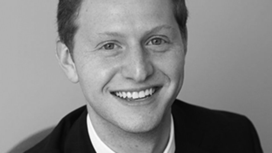 headshot of Matt Lerner wearing a suit and tie grayscale photo