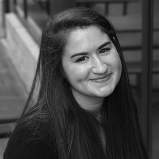 headshot of Rachael Schindler with long hair grayscale photo