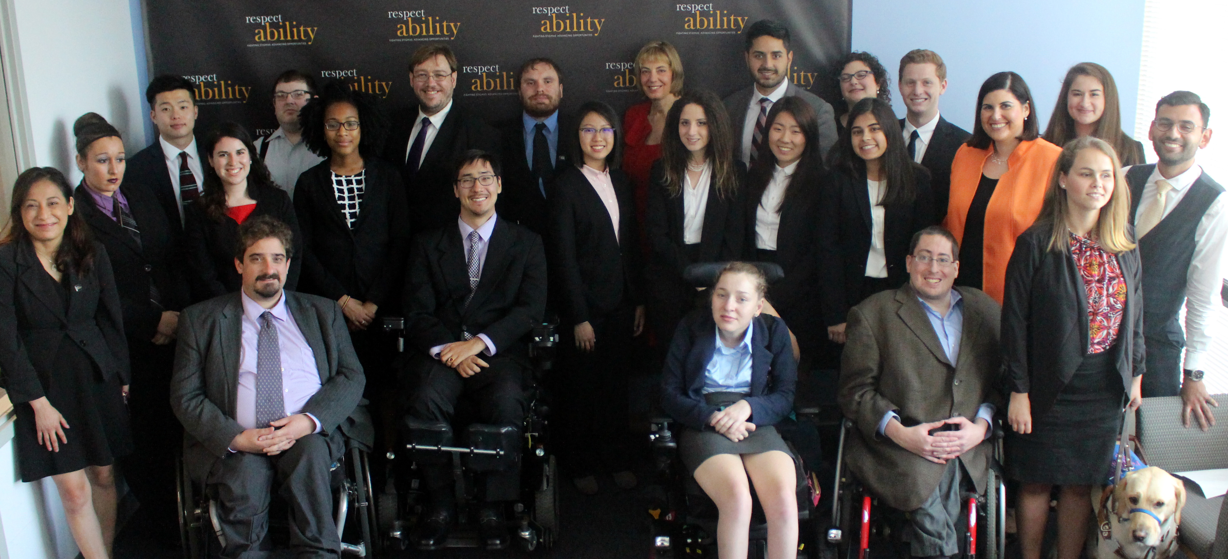 Randy Duchesneau and RespectAbility Fellows standing and seated in a posed photograph, smiling for the camera