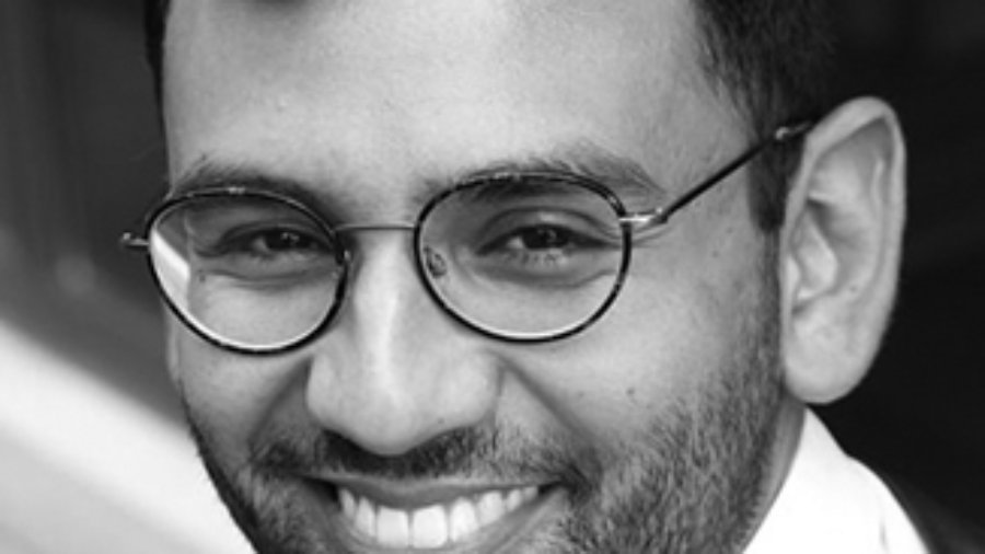 headshot of Ricky Rendon wearing glasses grayscale photo