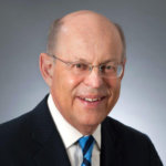 headshot of Ronald Glancz wearing glasses and a blue tie color photo