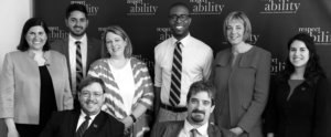 Black and white image of RespectAbility staff - some standing and some seated in chairs and wheelchairs