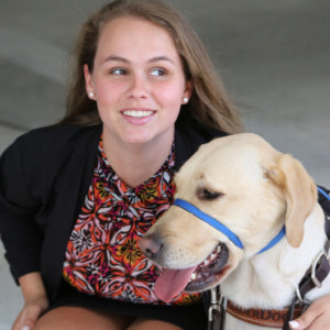 Stephanie Flynt with service dog Nala color photo