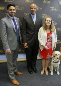 Christopher Trujillo on the left Floyd Mills in the center and Stephanie Flynt on the right with Nala, who is her service animal. Nala is a yellow lab.
