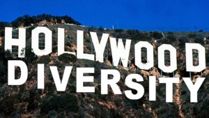 letters spelling out Hollywood and Diversity on top of a mountain with trees