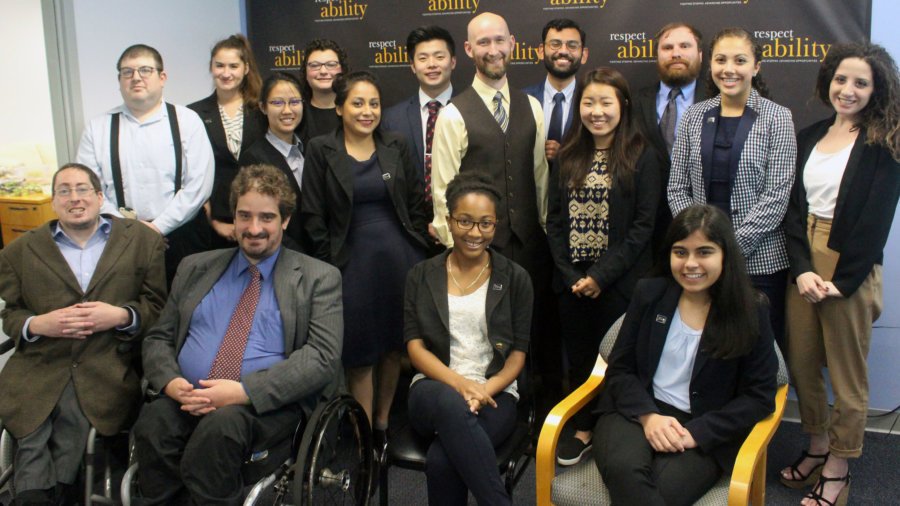 Michael Murray with Fellows sitting and standing around him