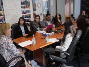 Debbie Ratner Salzberg speaking to RespectAbility Fellows seated around a large brown table