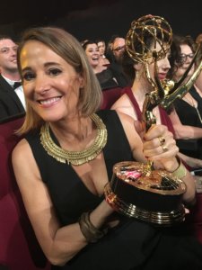 Casting Director Sasha Alpert holding her Emmy