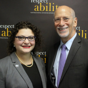 RespectAbility Fellow Emma Adelman and Patrick McCarthy posing and smiling for a photo