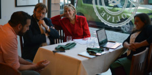 Dan Tapia seated at a table with a man and two women