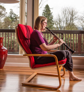 Jenny Lay Flurrie playing the clarinet on her deck