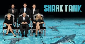 Shark Tank promo photo showing six main sharks seated and standing above a shark tank with the words "Shark Tank"