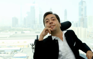 Dr. Victor Pineda with a backdrop of a city's skyline behind him