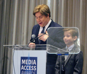 Stephen Chbosky and Jacob Tremblay announcing an award for David Hoberman and Todd Lieberman