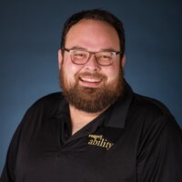 Ben Bond smiling headshot in front of a blue gradient backdrop