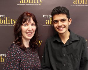 Heidi Daroff and RespectAbility Fellow Bryan Munguia in front of the RespectAbility banner