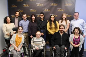 Heidi Daroff with RespectAbility staff and Fellows in front of the RespectAbility banner