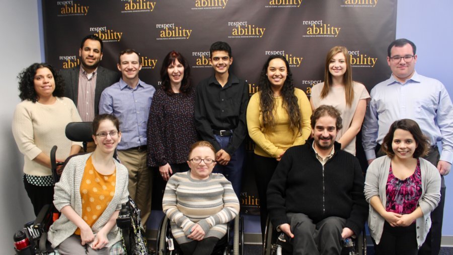 Heidi Daroff with RespectAbility staff and Fellows in front of the RespectAbility banner