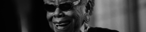 Close up black and white photo of Maya Angelou wearing sunglasses