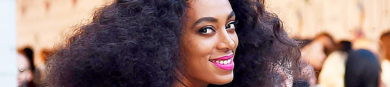 Close up of Solange Knowles wearing pink lipstick