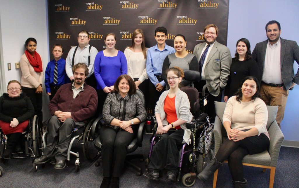 Donna Meltzer with RespectAbility staff and Fellows in front of the RespectAbility banner