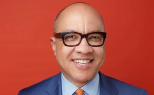 Darren Walker Headshot against a red background