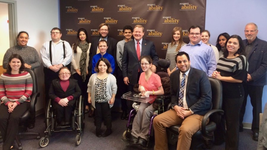 Steve Bartlett with RespectAbility staff and Fellows in front of the RespectAbility banner