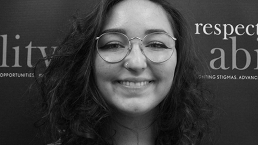 Headshot of Rachael Walloga in front of the Respectability banner