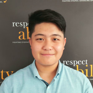 Thomas Noh is smiling in front of the Respectability banner