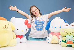 Megan Bomgaars in the middle of four dolls from Sanrio
